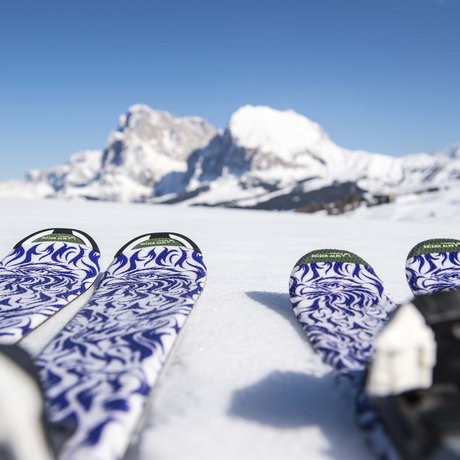 Hotel Schmung: our picture gallery Skis with blue and white patterns on snow with mountain view