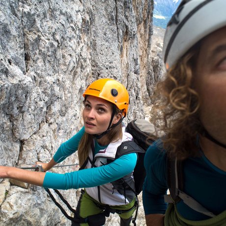 Hotel Schmung: our picture gallery Two climbers wearing helmets securing themselves on a mountain rock wall