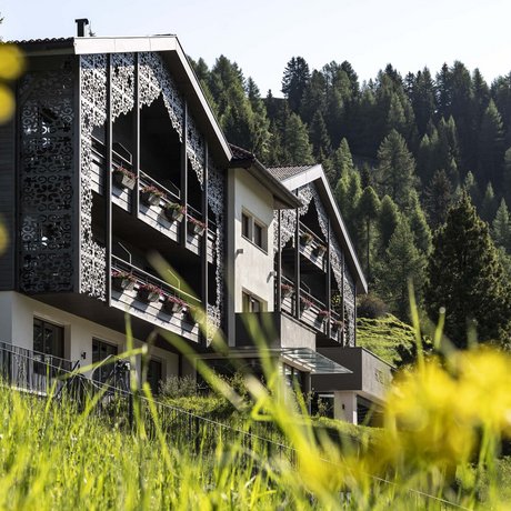 Hotel Schmung: our picture gallery Hotel with decorative balconies in green mountain landscape