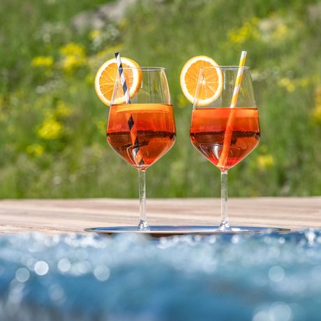 Hotel Schmung: our picture gallery Two Aperol Spritz with orange slices on a tray next to water