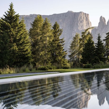 Hotel Schmung: our picture gallery Mountain landscape with trees and reflection in a still pool
